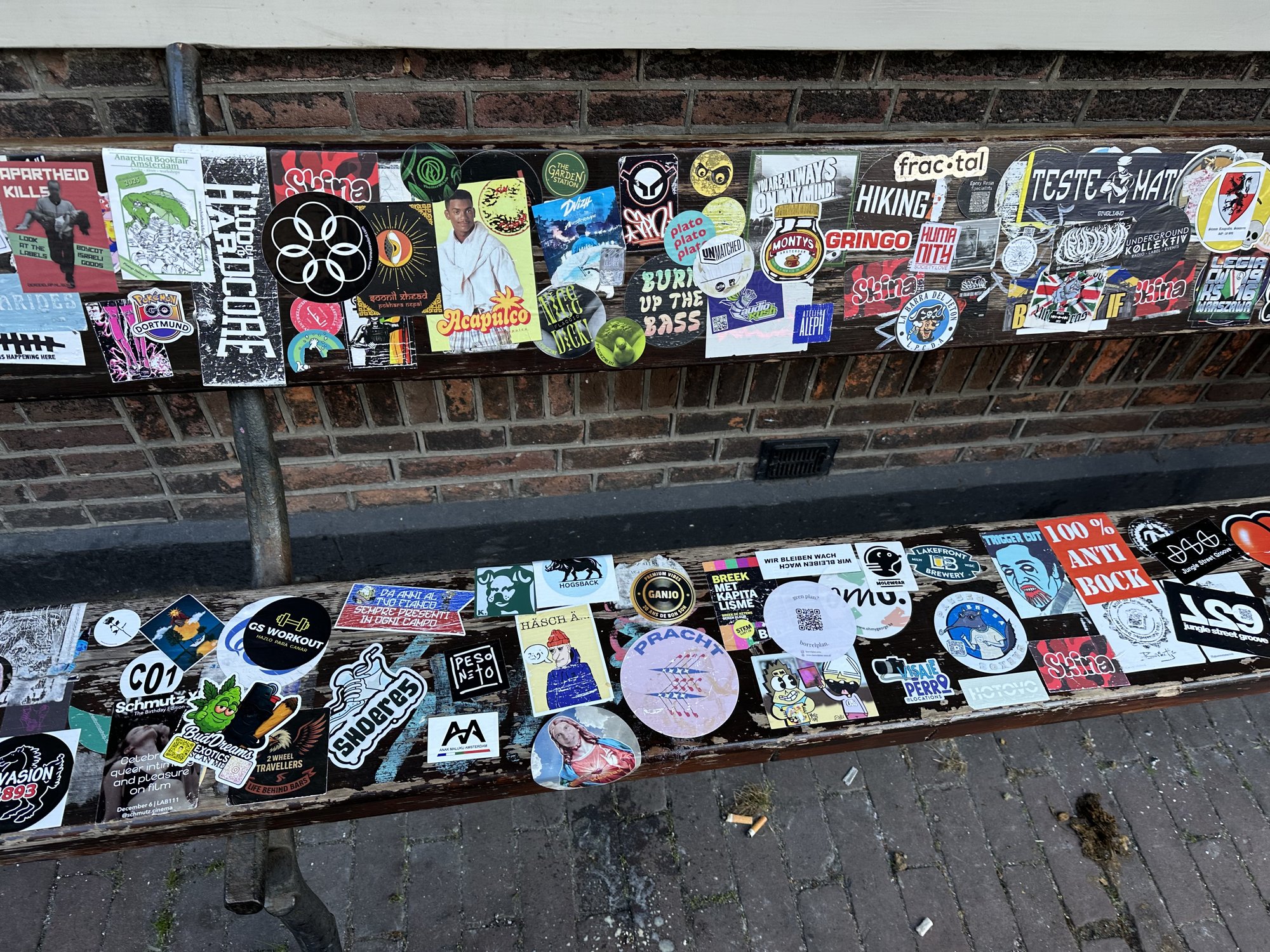 The seat and backrest of the bench, packed with stickers